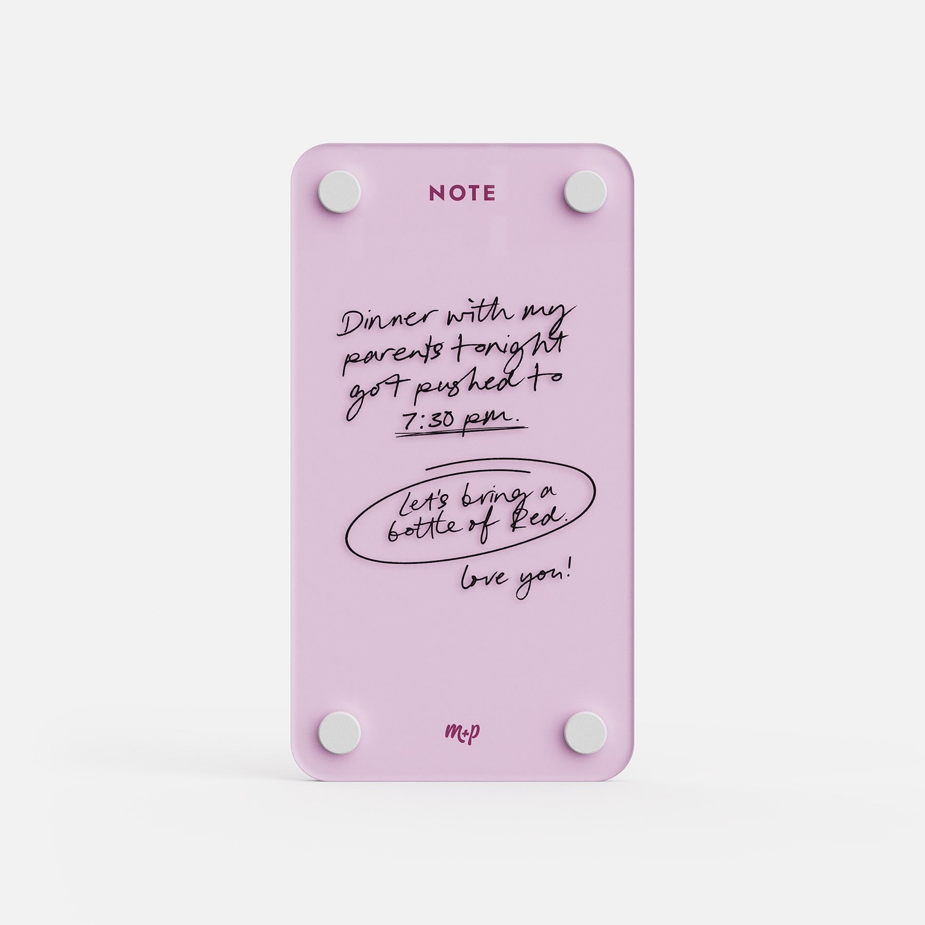 Ballet pink tall magnetic acrylic note board with a handwritten message about dinner moving to 7:30